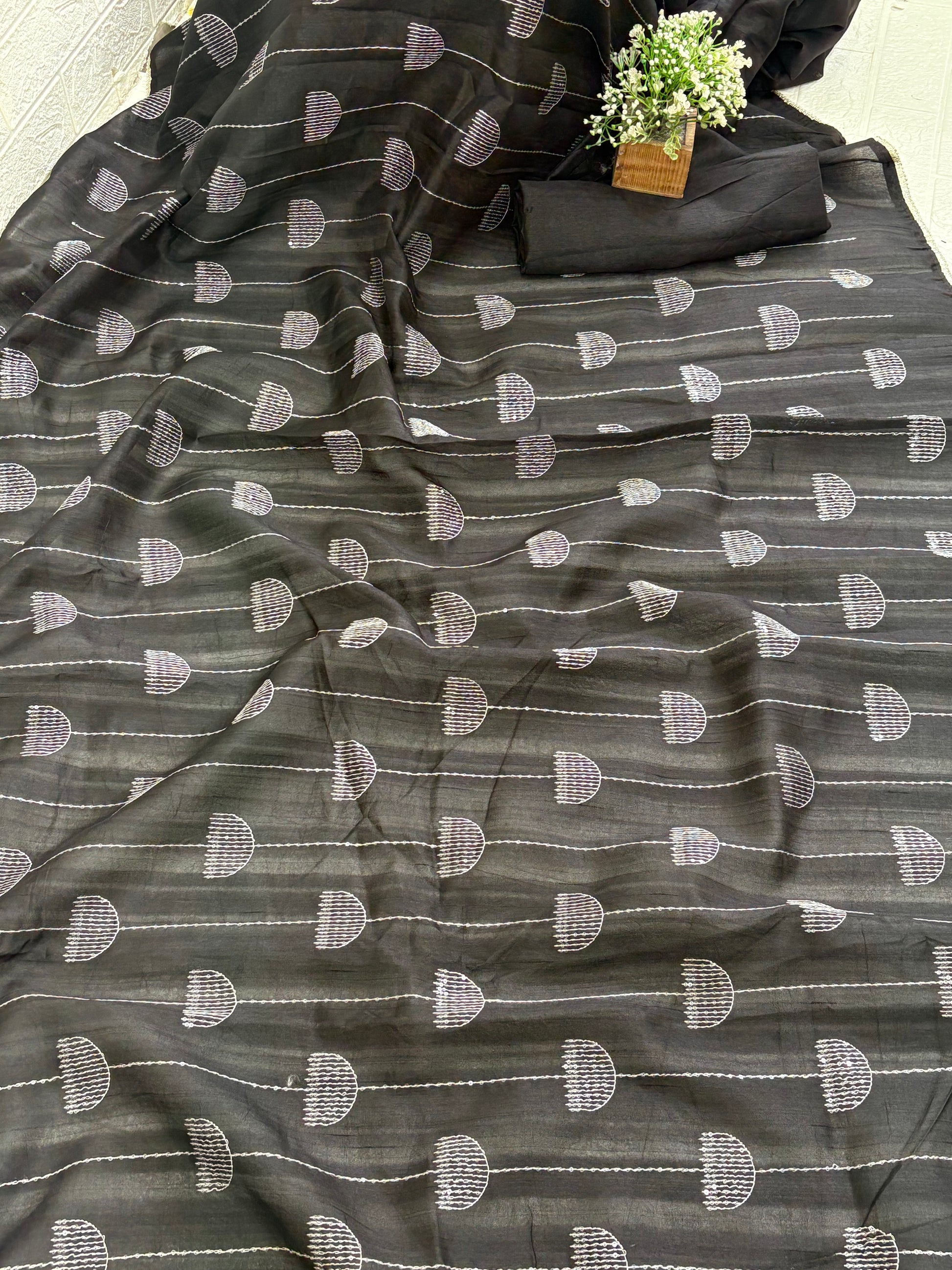 Name: Chanderi or Cotton Silk Saree The texture and slight sheen indicate a Chanderi or Cotton Silk Blend. With blouse The design features woven Zari lines/stripes and small thread/Aari embroidery motifs.