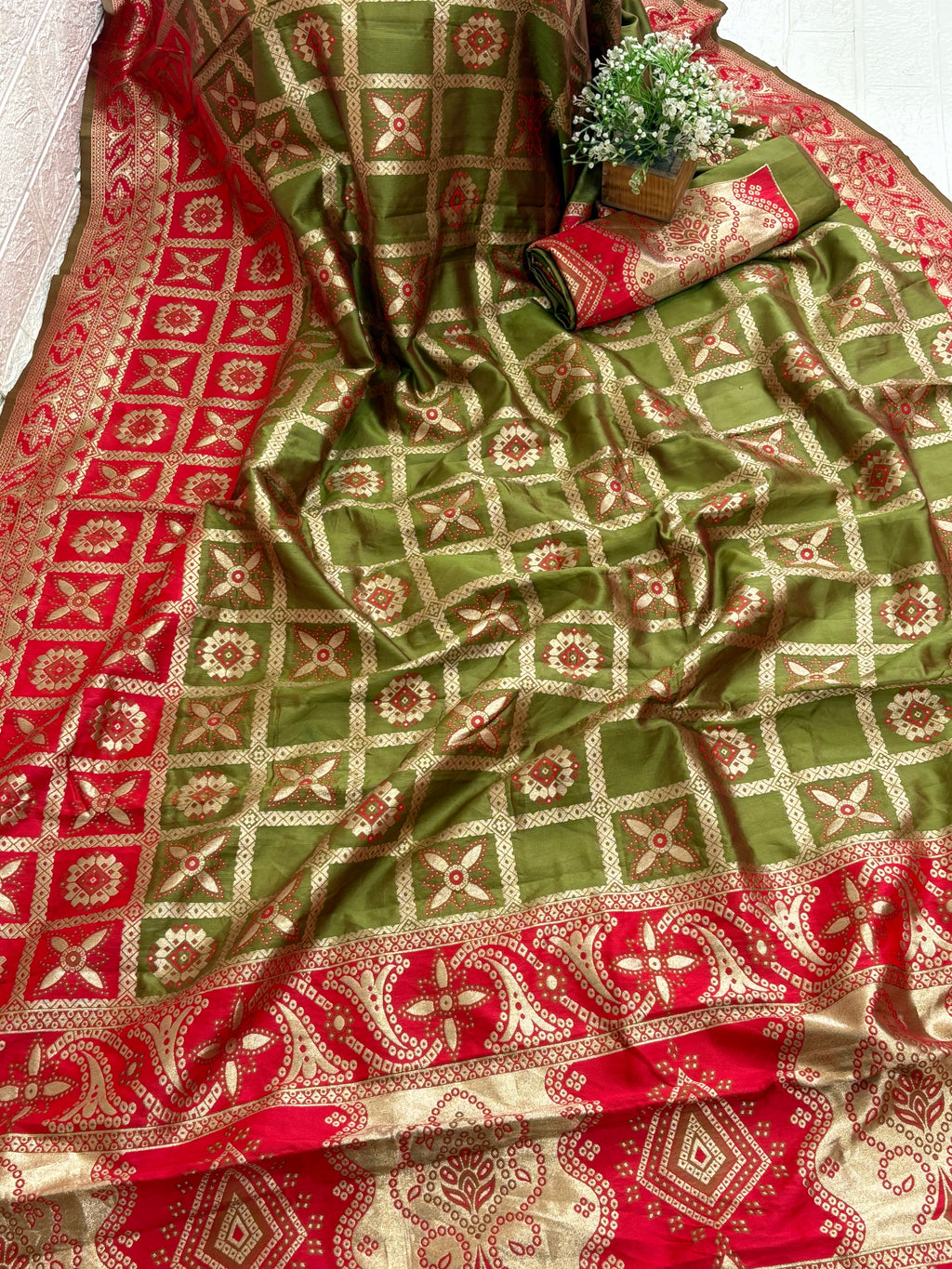 Name: Olive green Saree
Fabric: Pure Art silk blend adorned with traditional block print motifs and a contrasting red border for a timeless ethnic appeal.