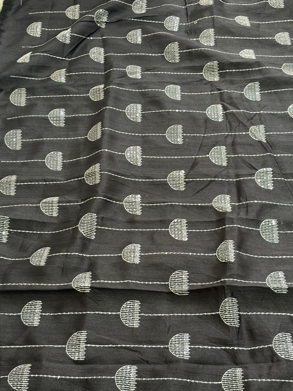 Name: Chanderi or Cotton Silk Saree The texture and slight sheen indicate a Chanderi or Cotton Silk Blend. With blouse The design features woven Zari lines/stripes and small thread/Aari embroidery motifs.