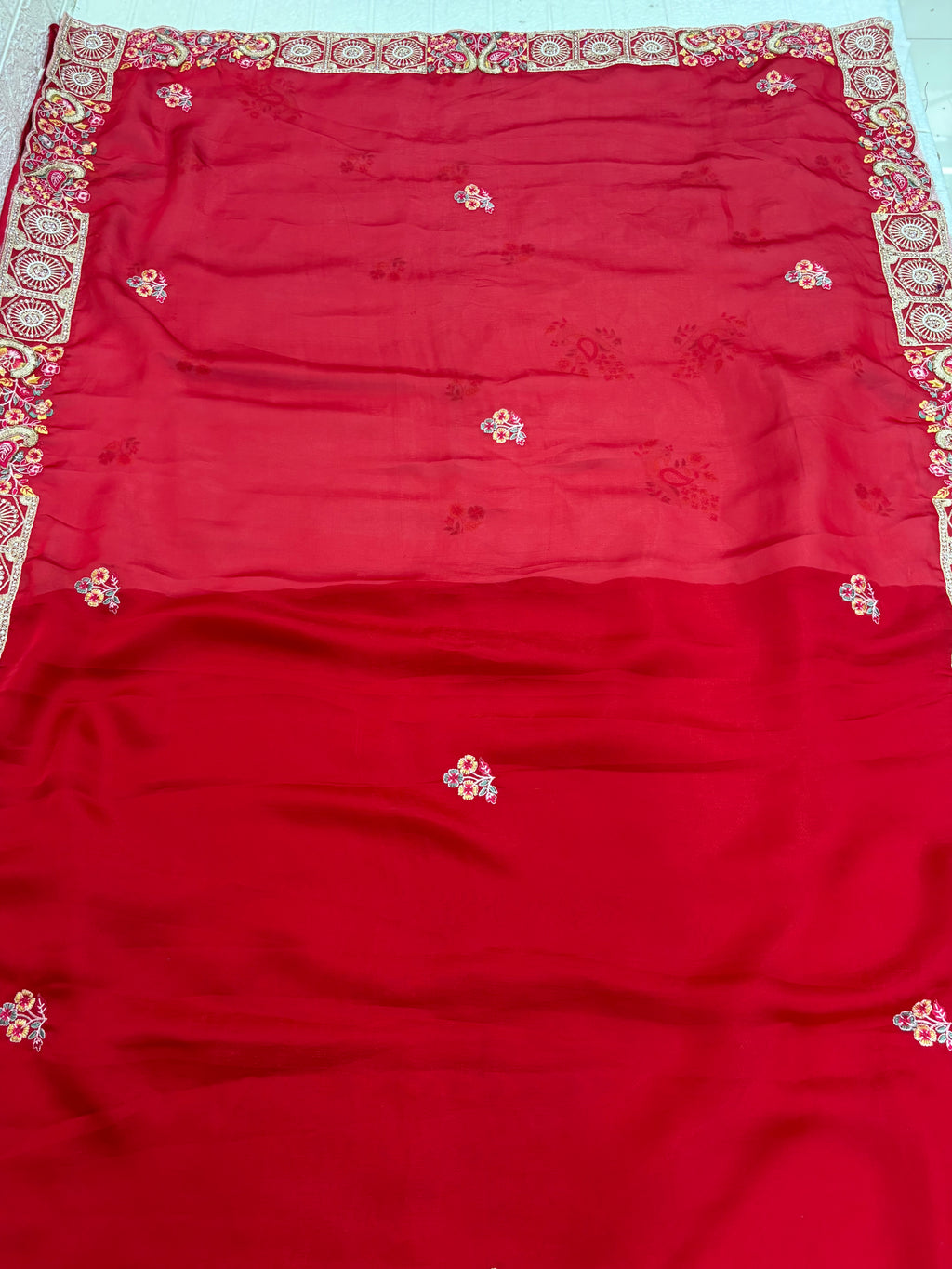 Name: Crimson Blossom saree Lightweight chiffon red colour with delicate floral embroidery and intricate border detailing.