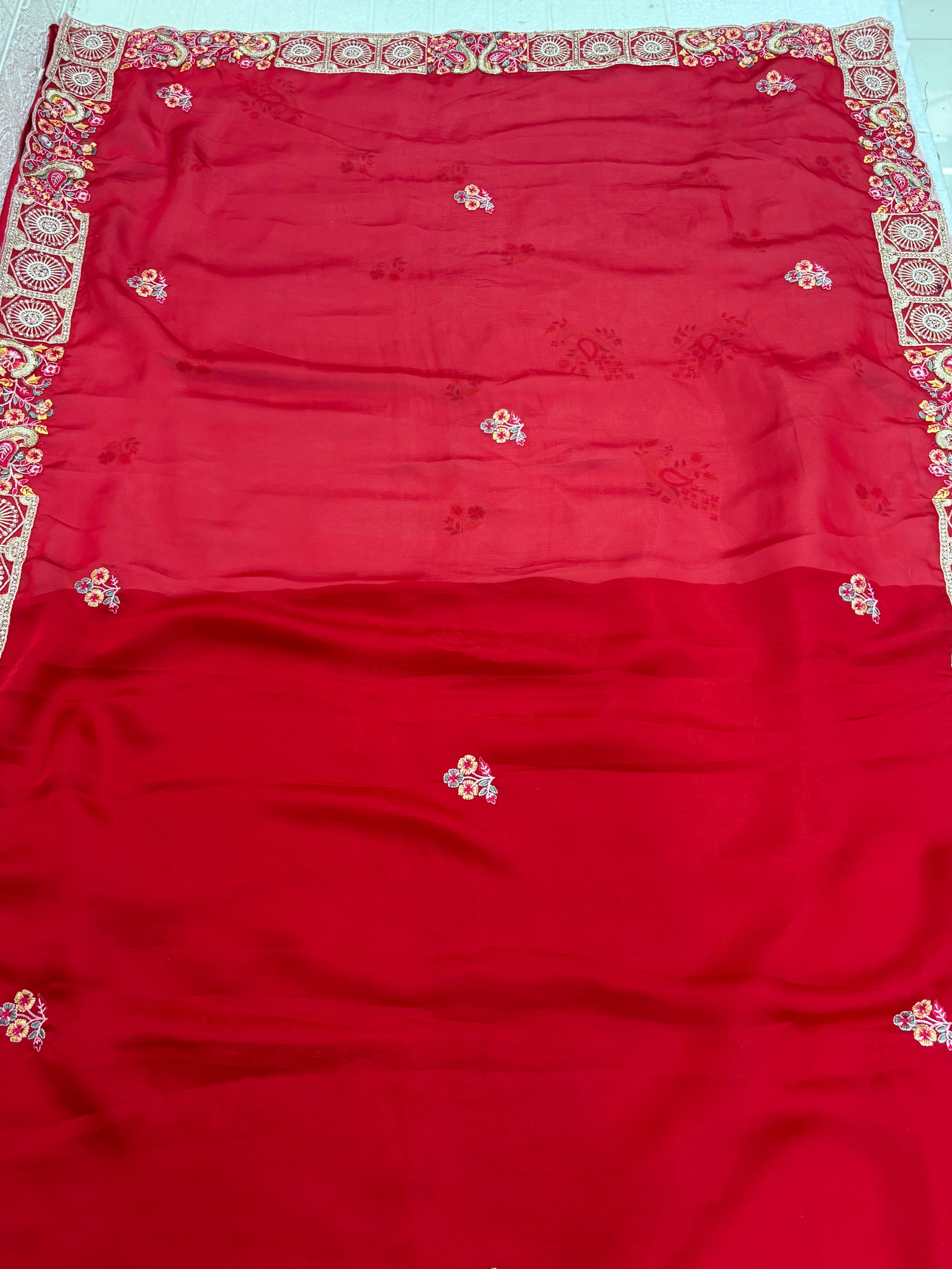 Name: Crimson Blossom saree Lightweight chiffon red colour with delicate floral embroidery and intricate border detailing.