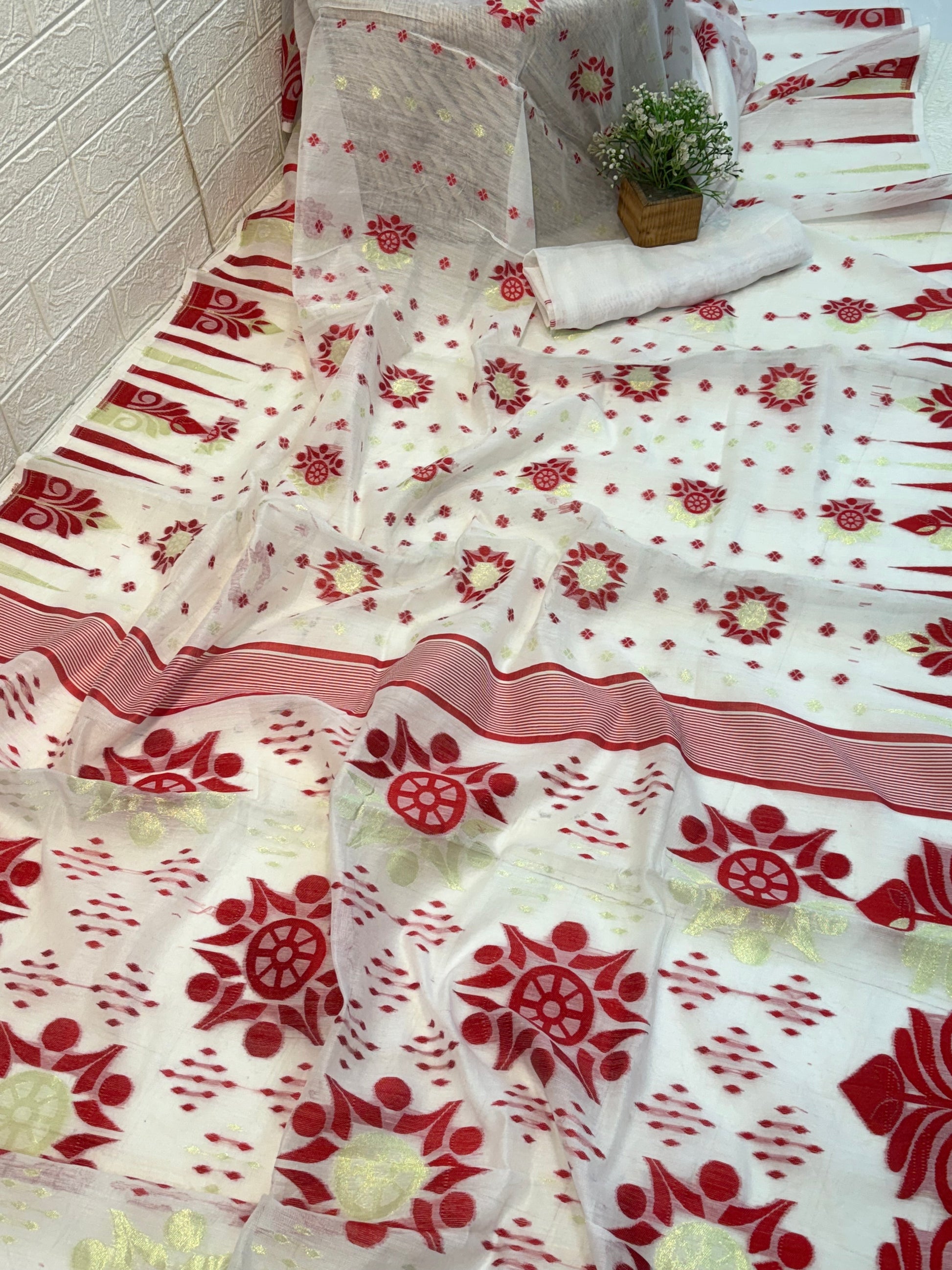 Classic Red Bloom Jamdani Saree cotton Jamdani, showcasing traditional red floral motifs with subtle gold accents on a soft, sheer handwoven base.