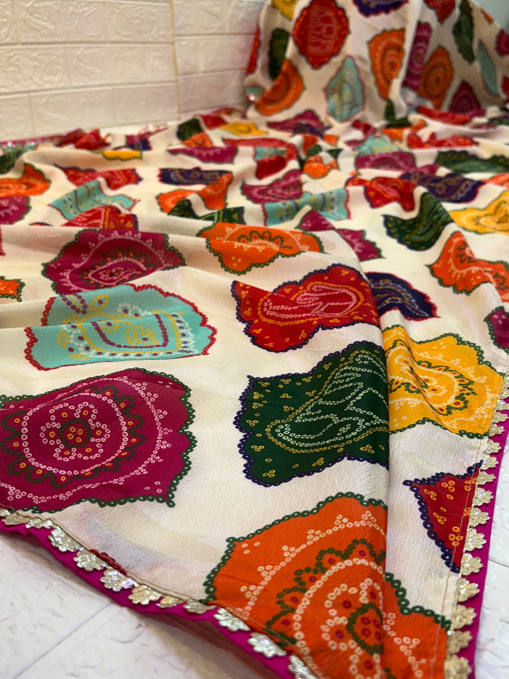 Name: Multicolor Bandhani Print Saree chinon fabric blend with vibrant traditional bandhani motifs, offering a festive and colorful ethnic appeal.