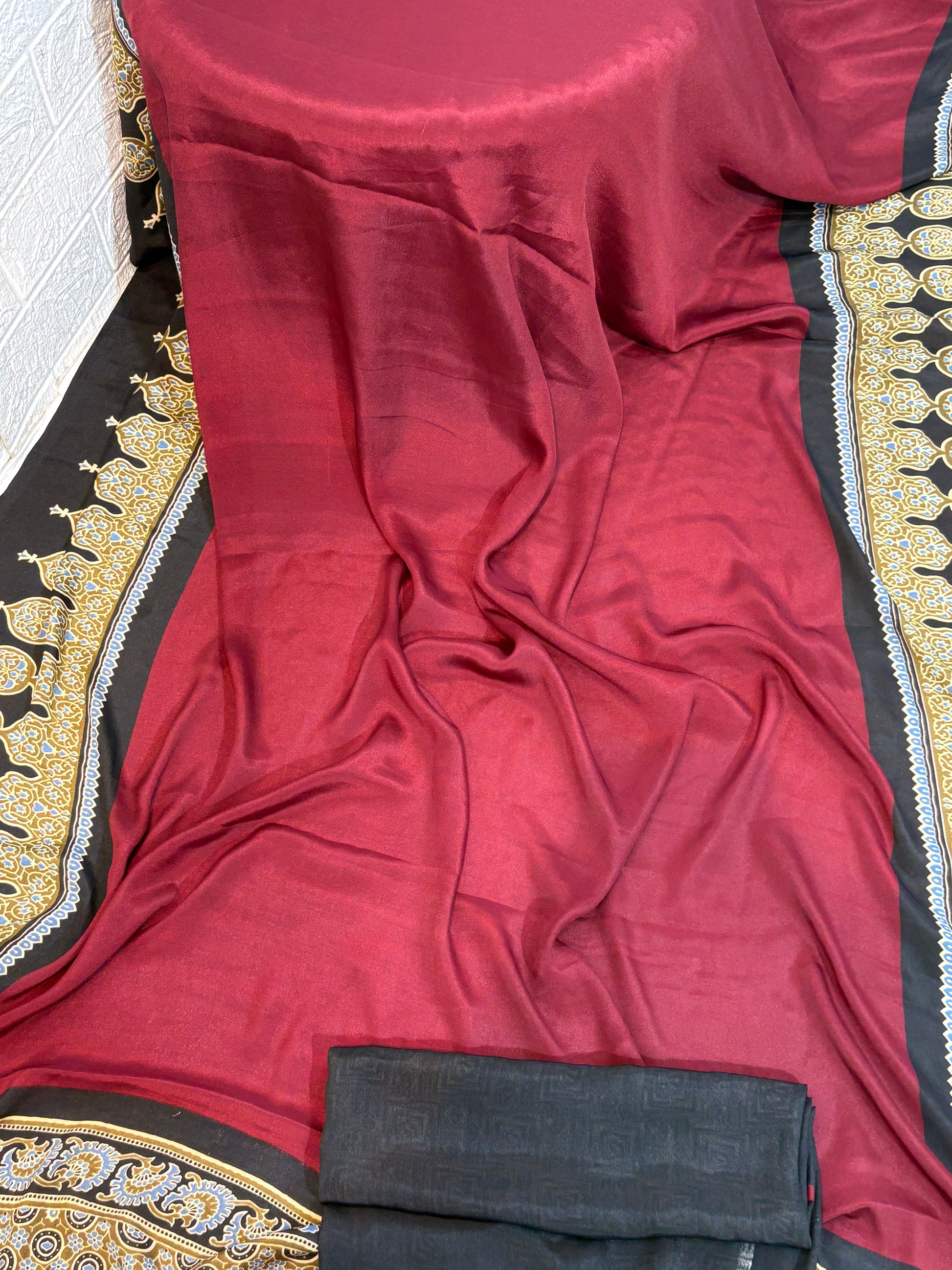 Elegance Border Saree
Crafted in soft crepe fabric, this mooru -colour aree features a striking black and gold printed border, offering a graceful drape with a rich, festive appeal.