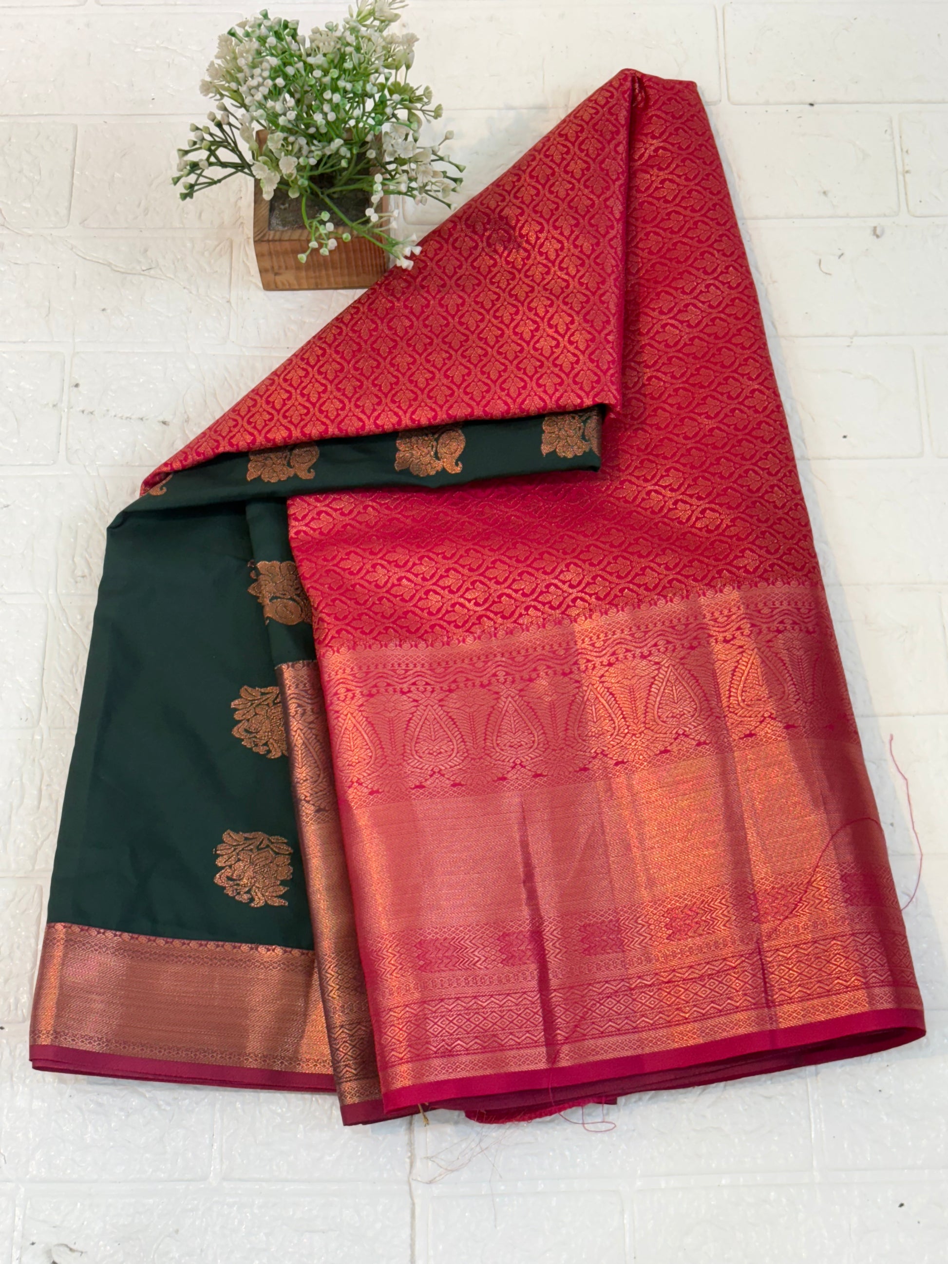 Name: soft silk with rich zari weaving in dark green and maroon contrast copper colour border and pallu.