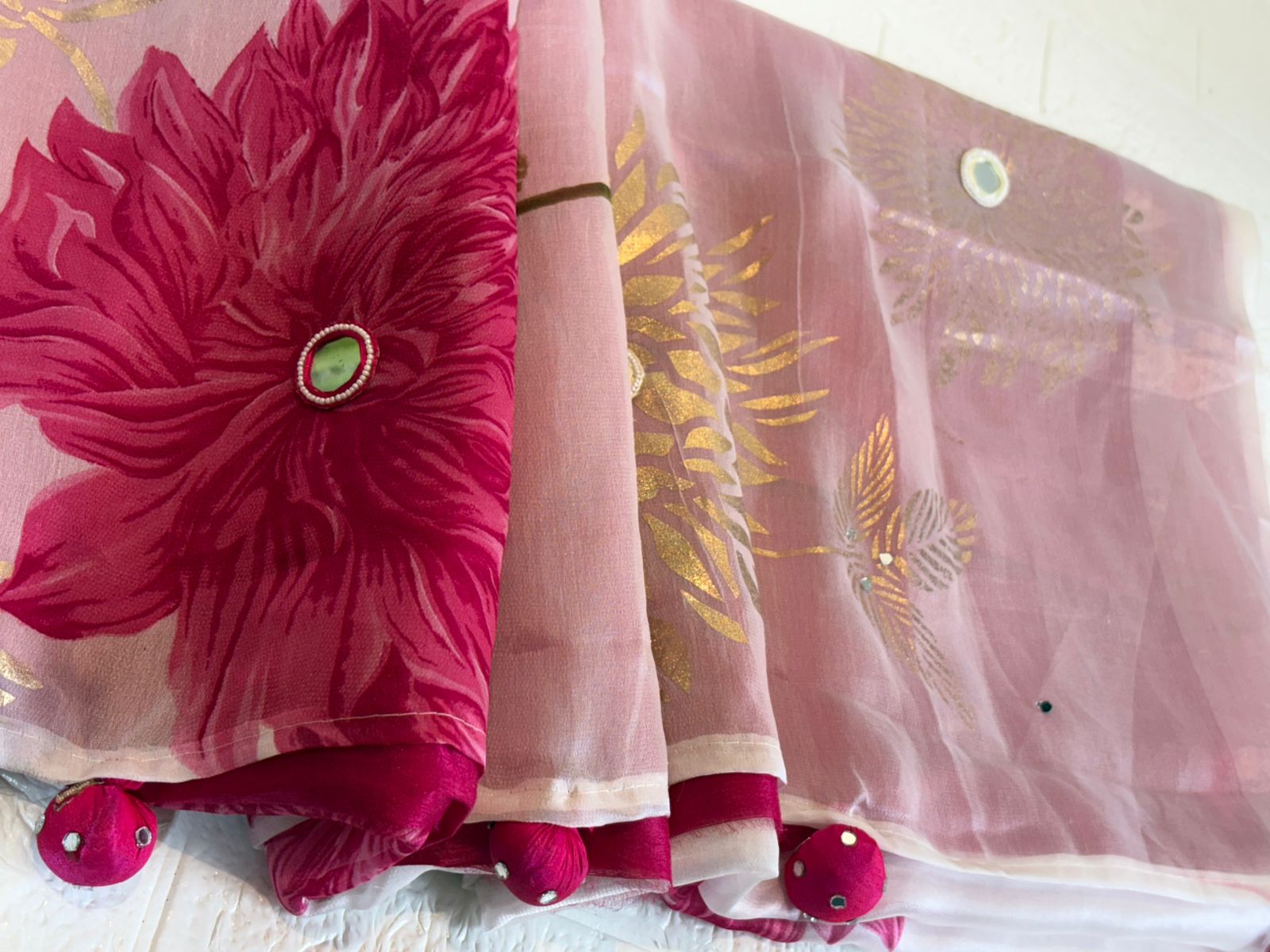 White Organza Saree with Pink Floral Prints and Golden Leaf Detailing