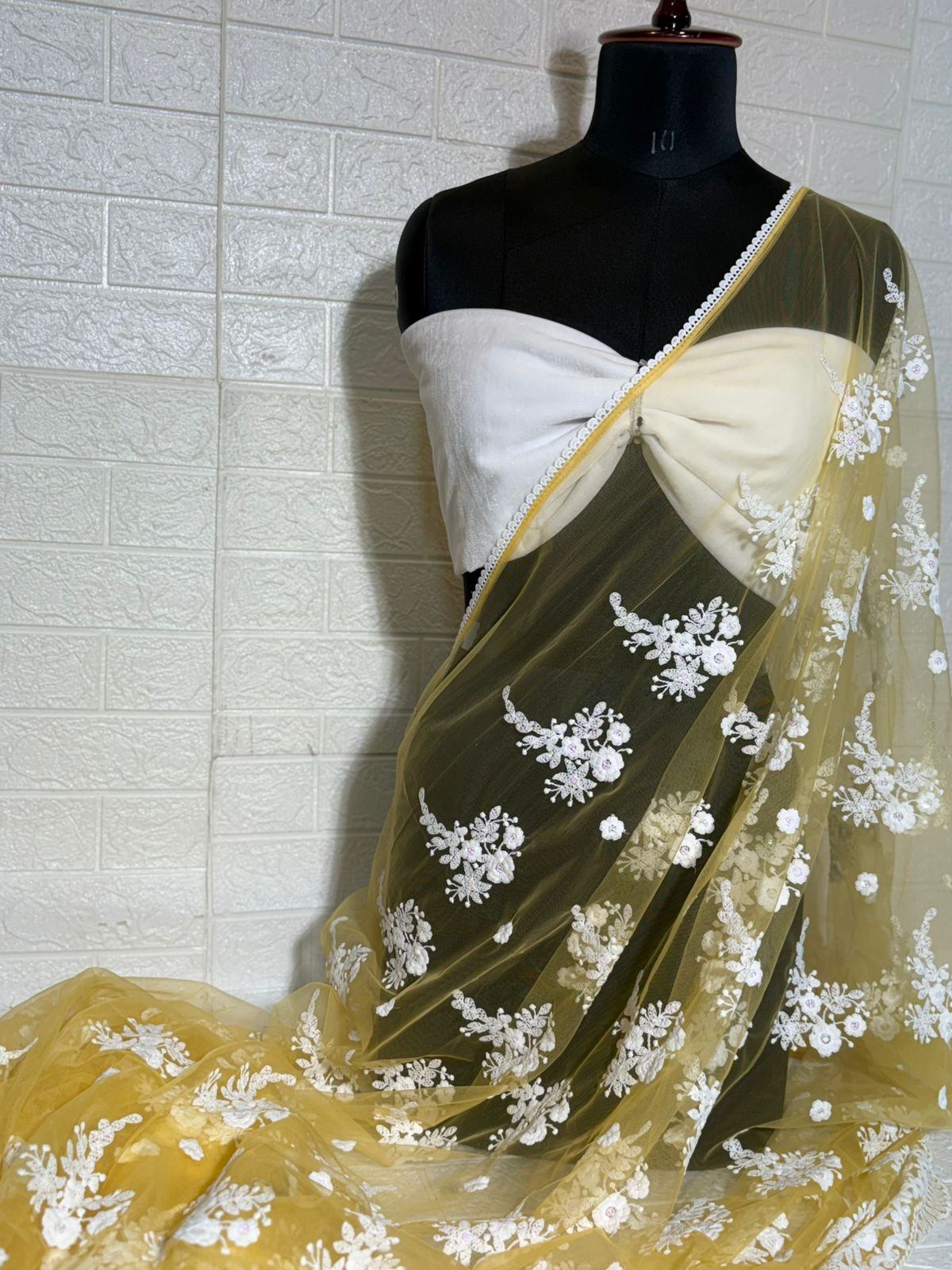 Pastel Yellow Net Saree with White Floral Embroidery