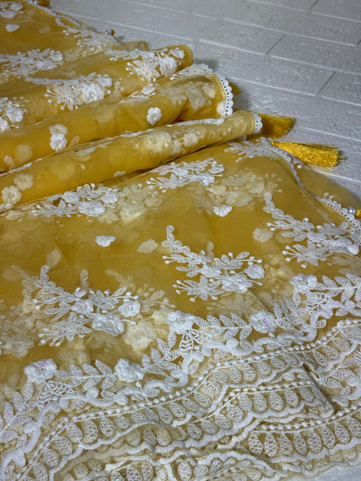 Pastel Yellow Net Saree with White Floral Embroidery