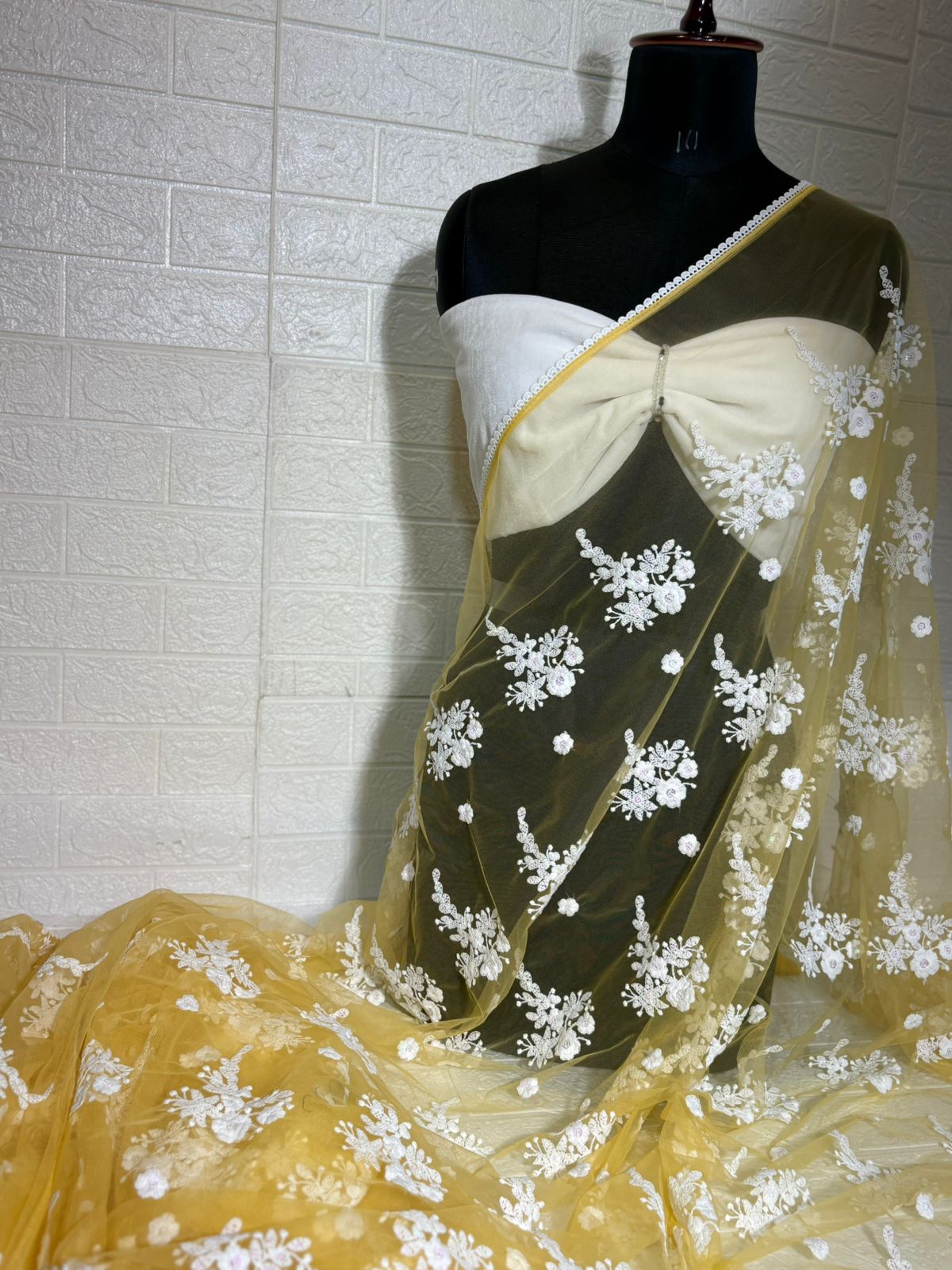 Pastel Yellow Net Saree with White Floral Embroidery