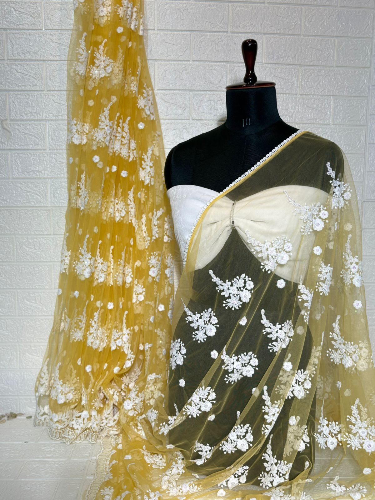 Pastel Yellow Net Saree with White Floral Embroidery