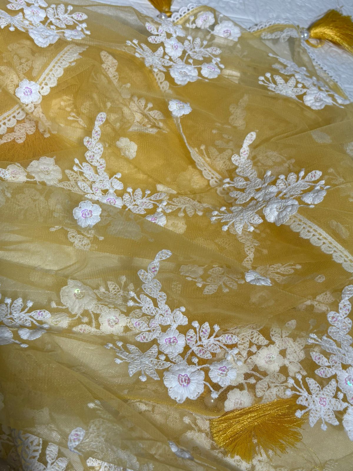 Pastel Yellow Net Saree with White Floral Embroidery