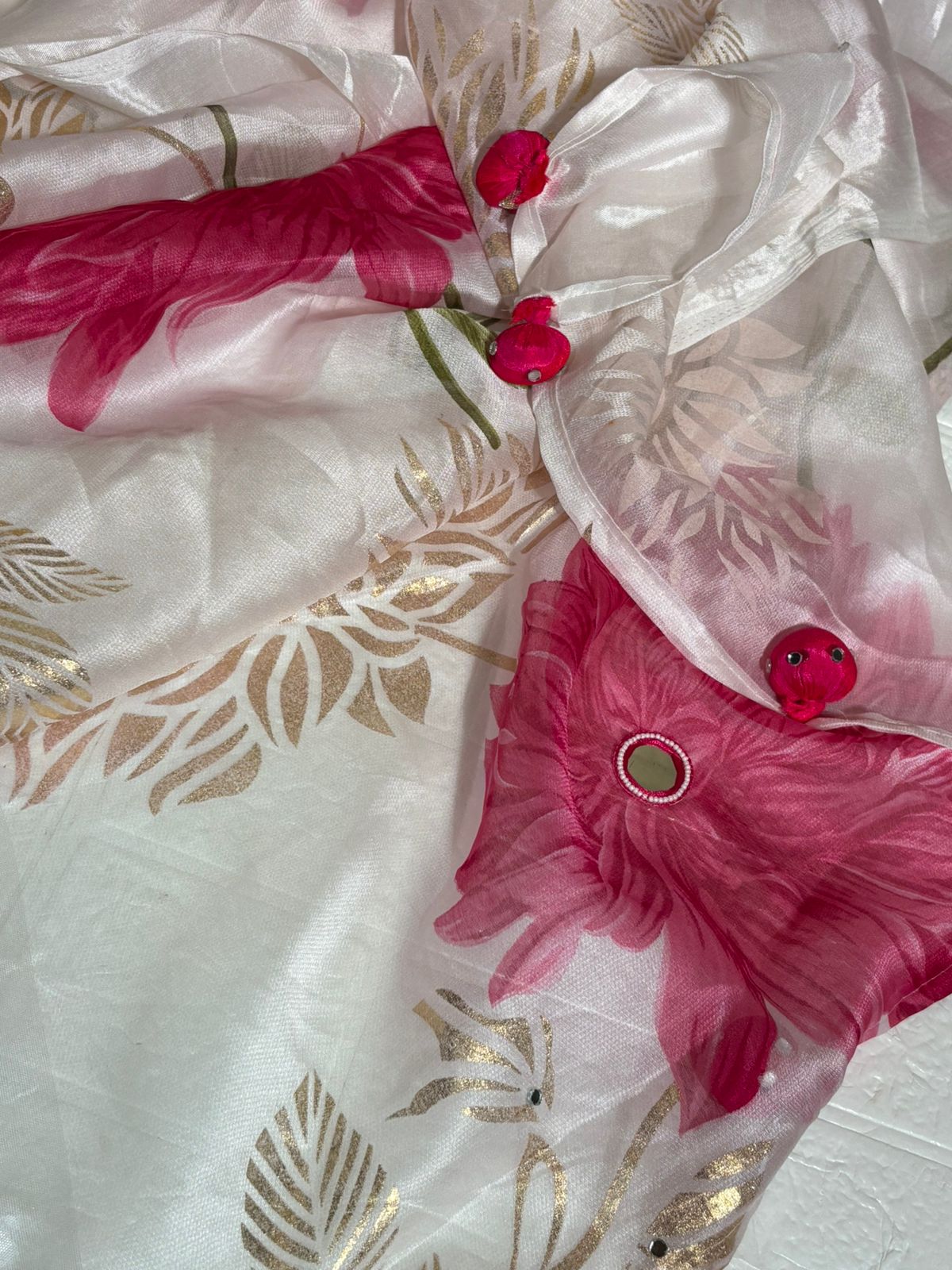 White Organza Saree with Pink Floral Prints and Golden Leaf Detailing
