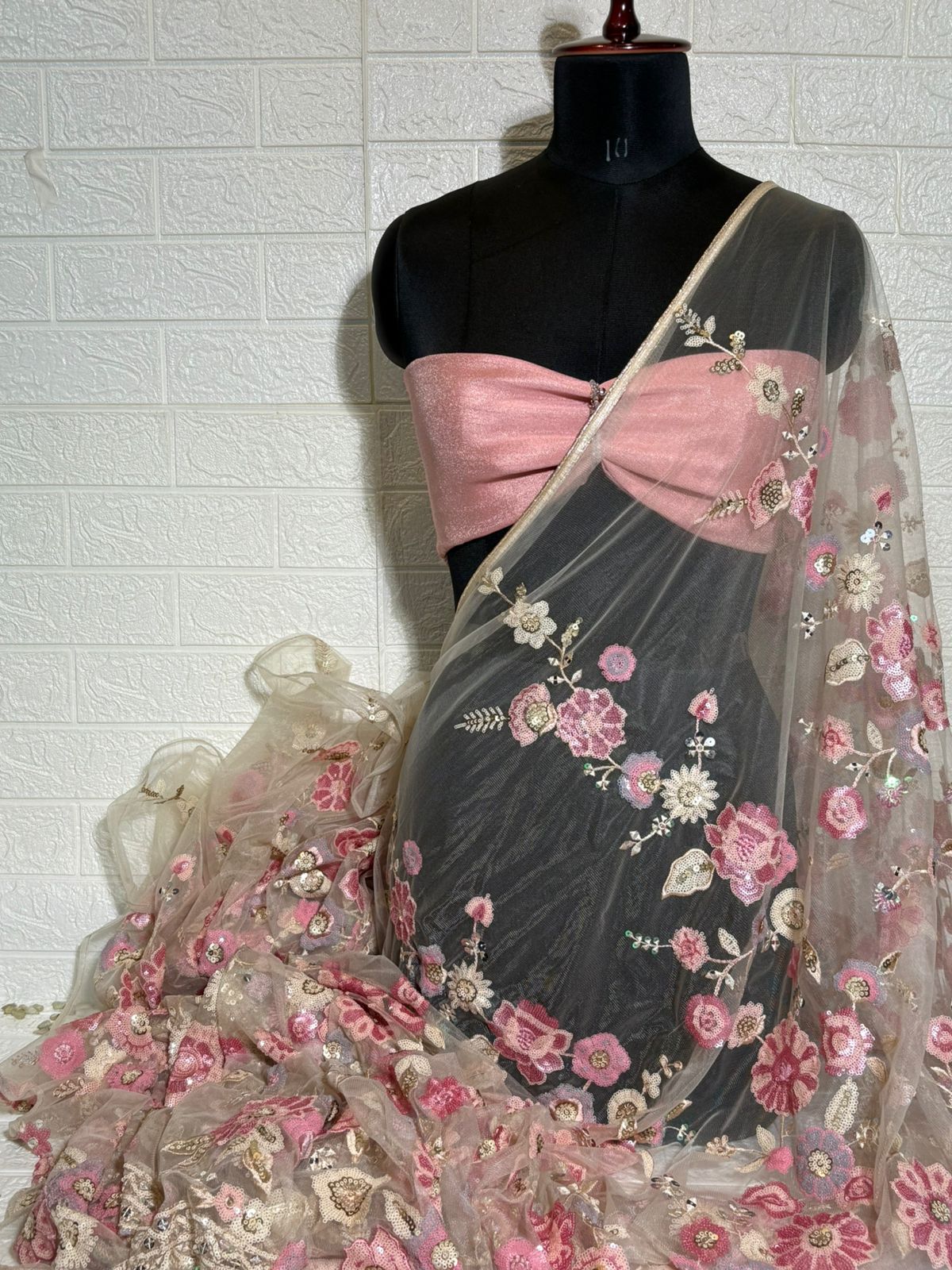 Beige Net Saree with Pink Floral Embroidery and Sequin Detailing