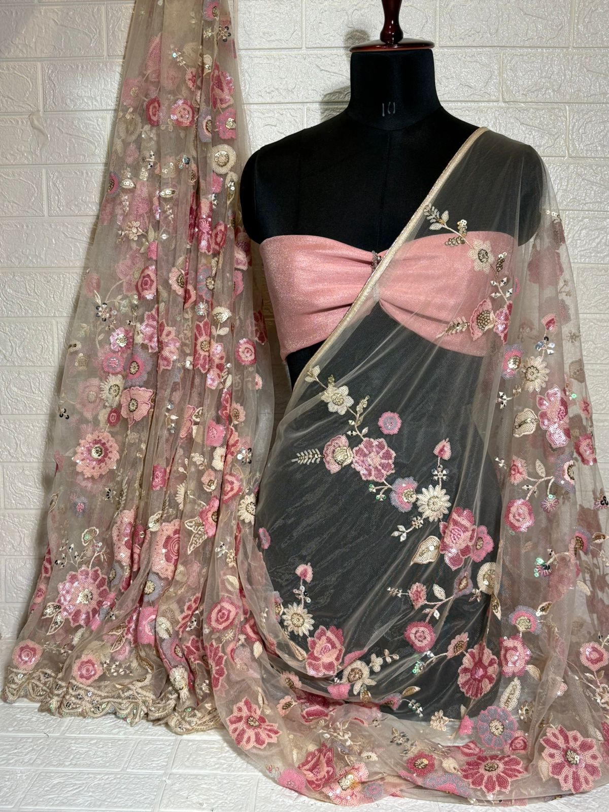 Beige Net Saree with Pink Floral Embroidery and Sequin Detailing
