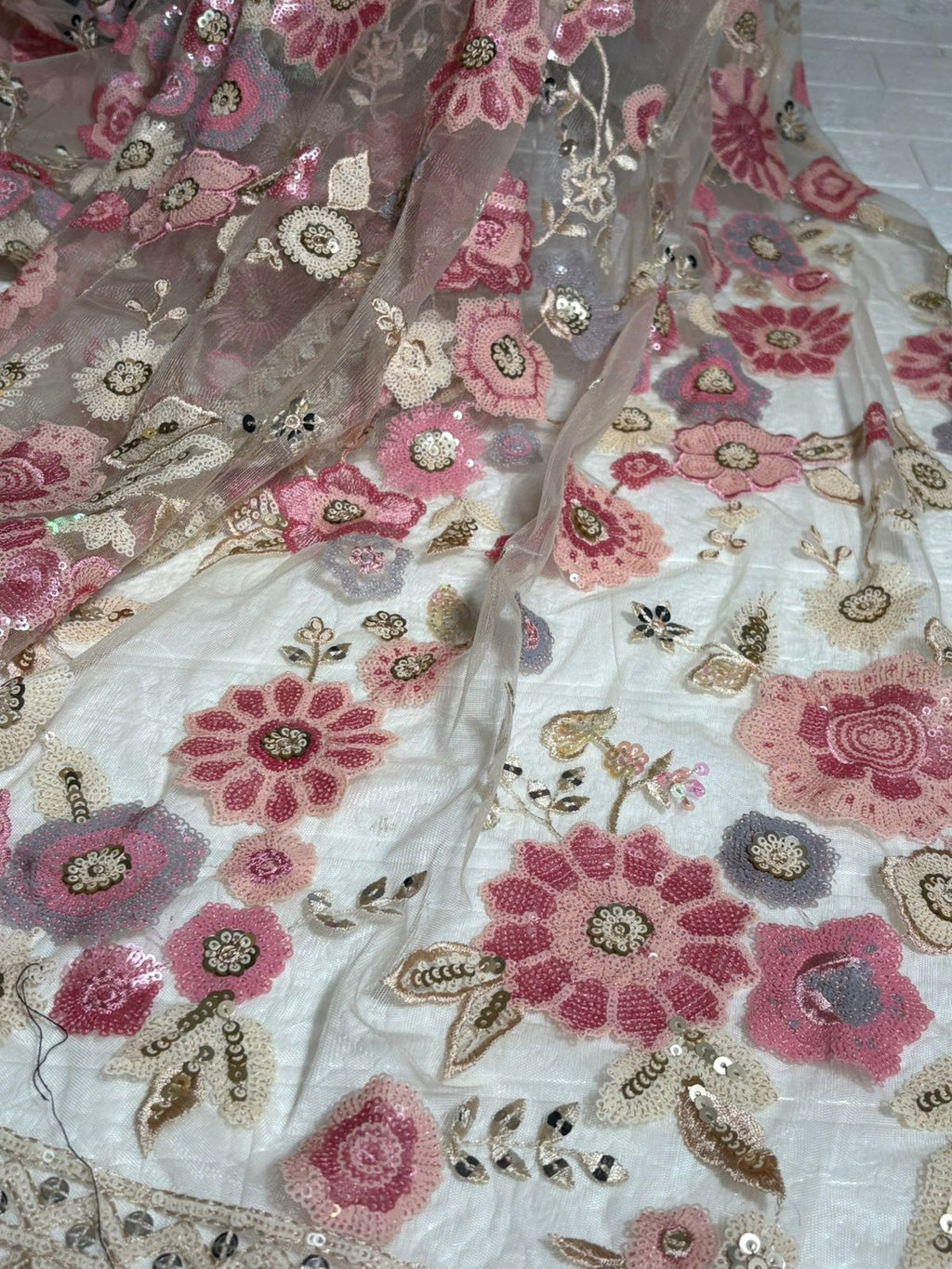 Beige Net Saree with Pink Floral Embroidery and Sequin Detailing