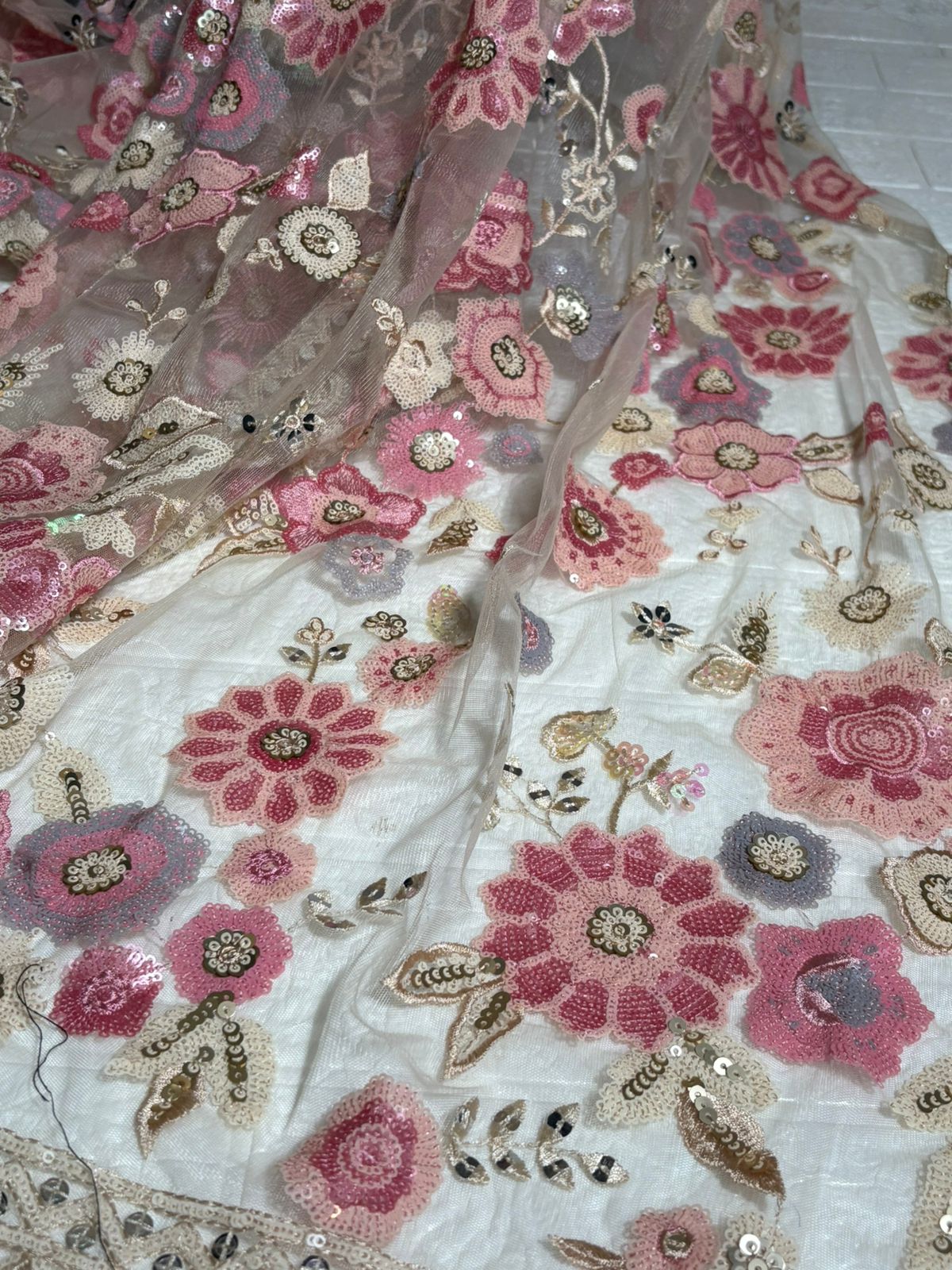 Beige Net Saree with Pink Floral Embroidery and Sequin Detailing