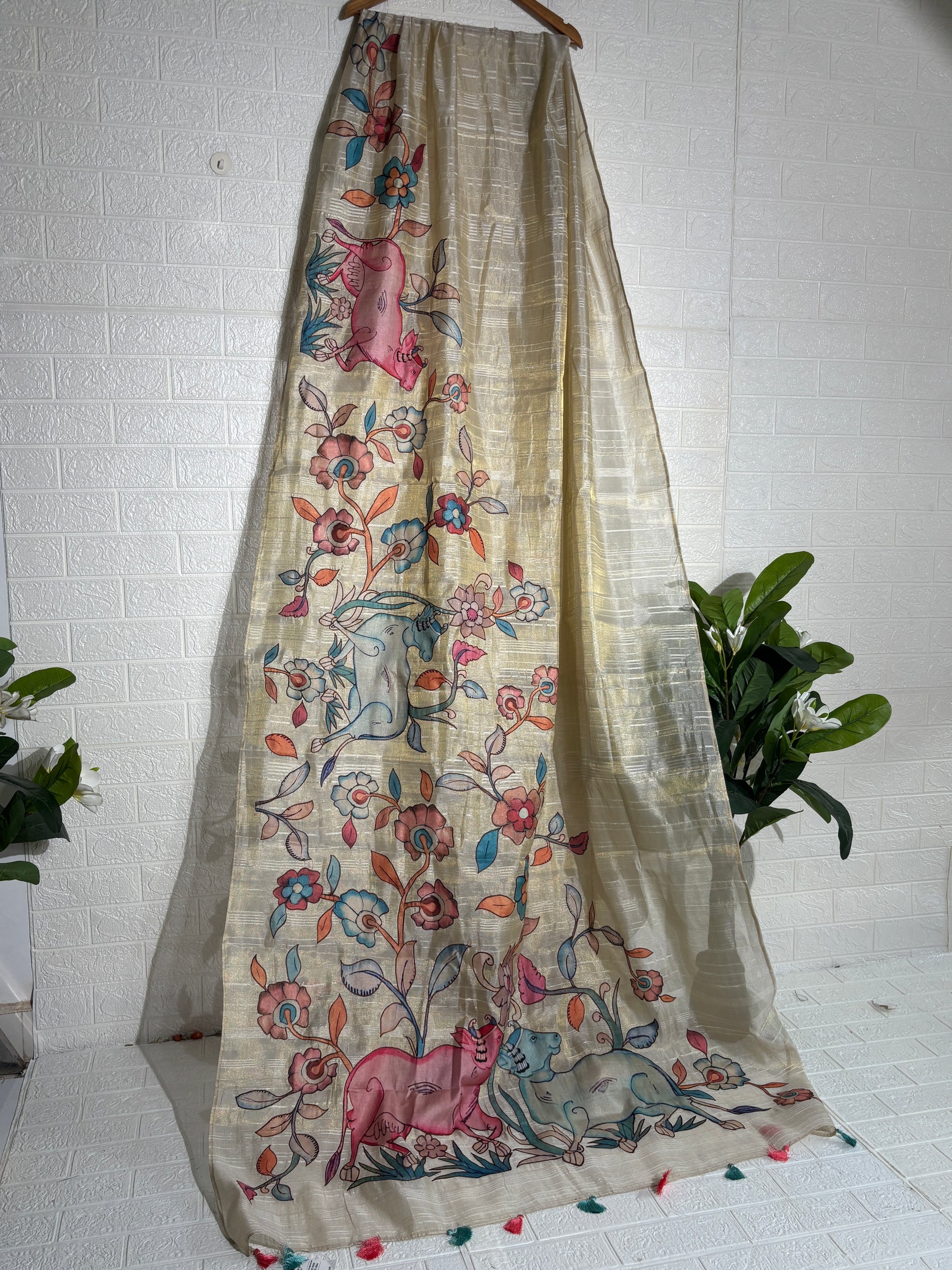 hand-painted silk saree featuring a Madhubani