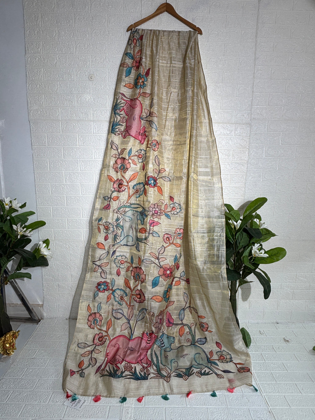 hand-painted silk saree featuring a Madhubani