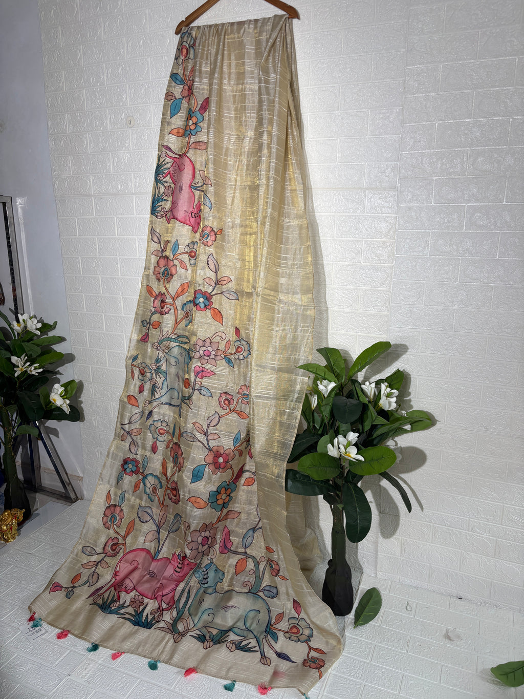 hand-painted silk saree featuring a Madhubani