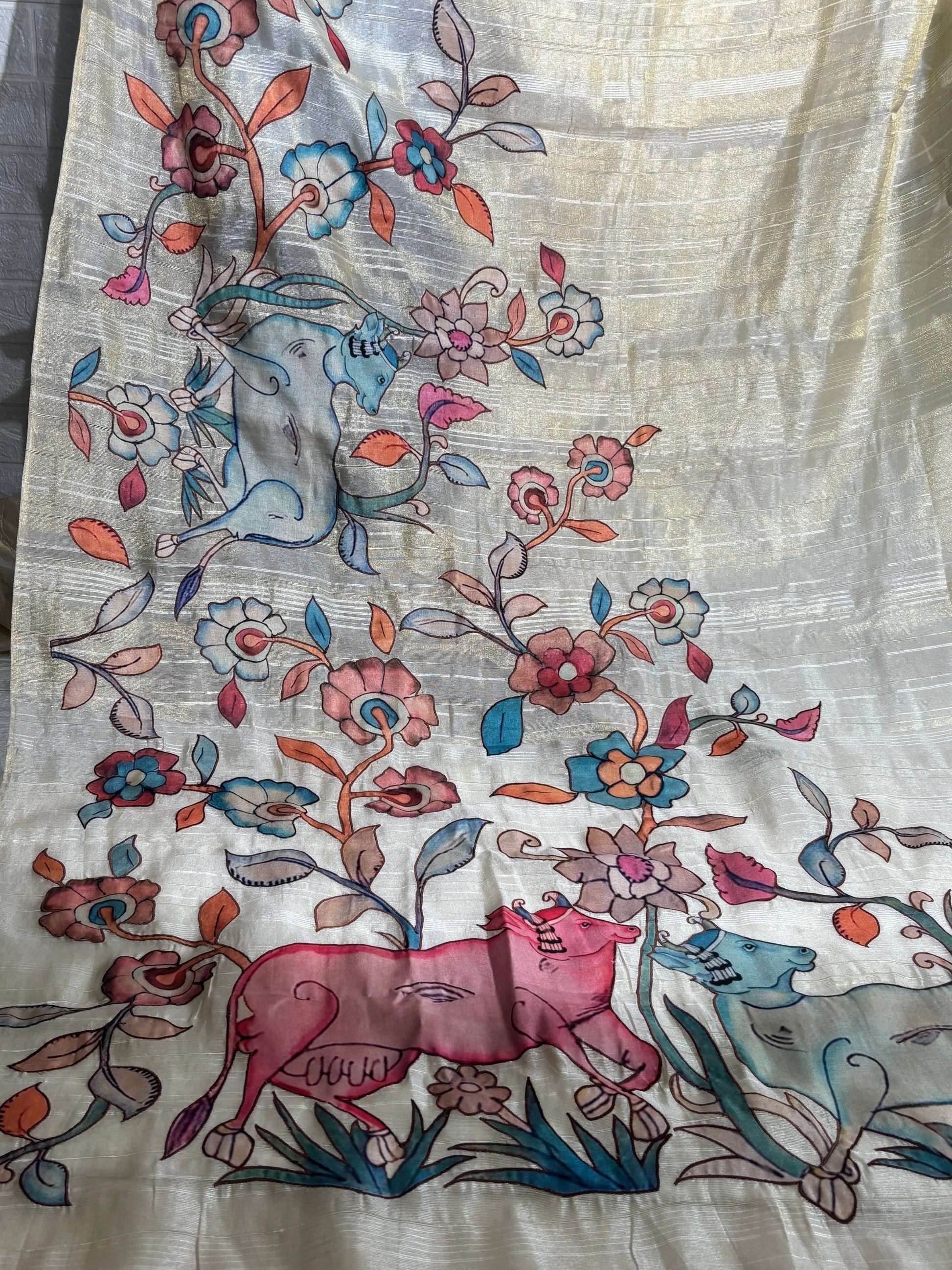 hand-painted silk saree featuring a Madhubani
