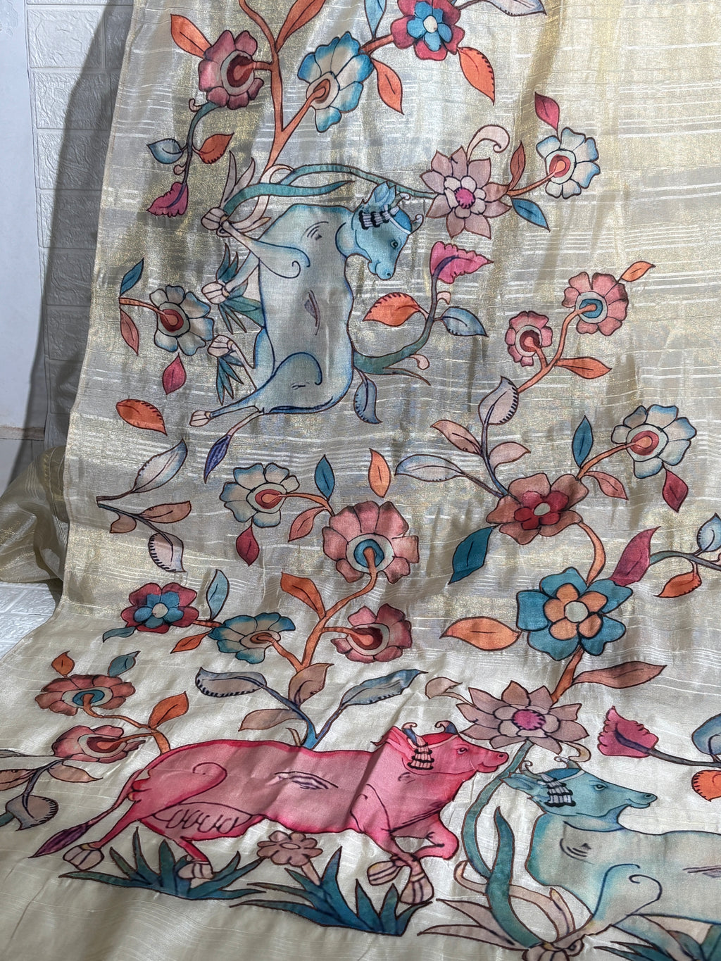 hand-painted silk saree featuring a Madhubani