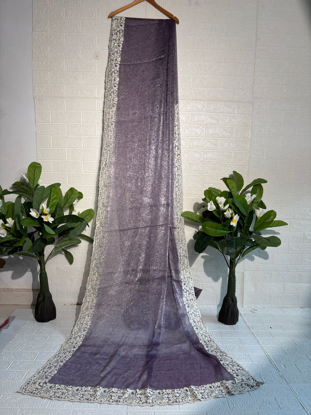 Shimmering Mauve Tissue Saree with Intricate Ivory Floral Border