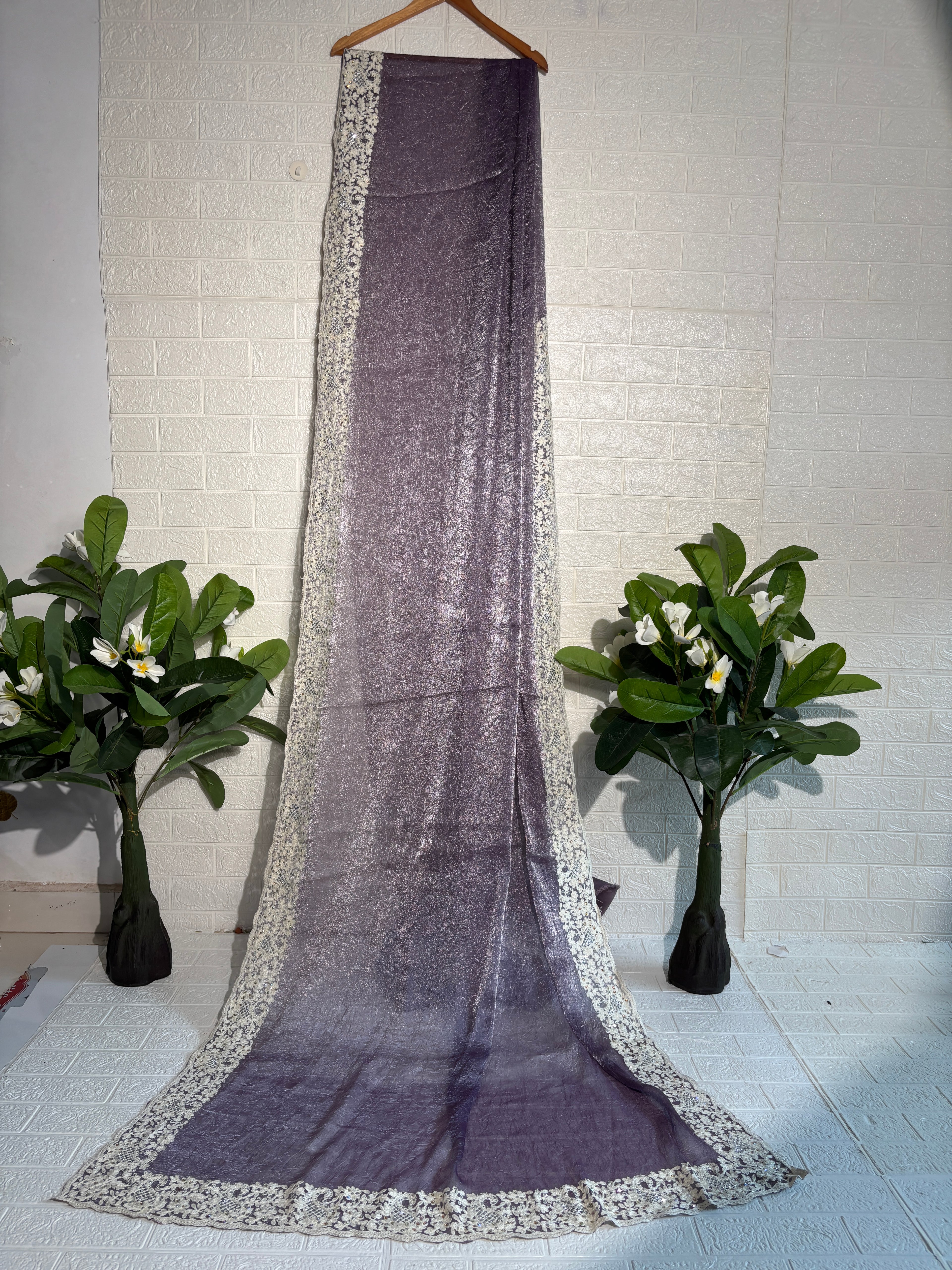 Shimmering Mauve Tissue Saree with Intricate Ivory Floral Border