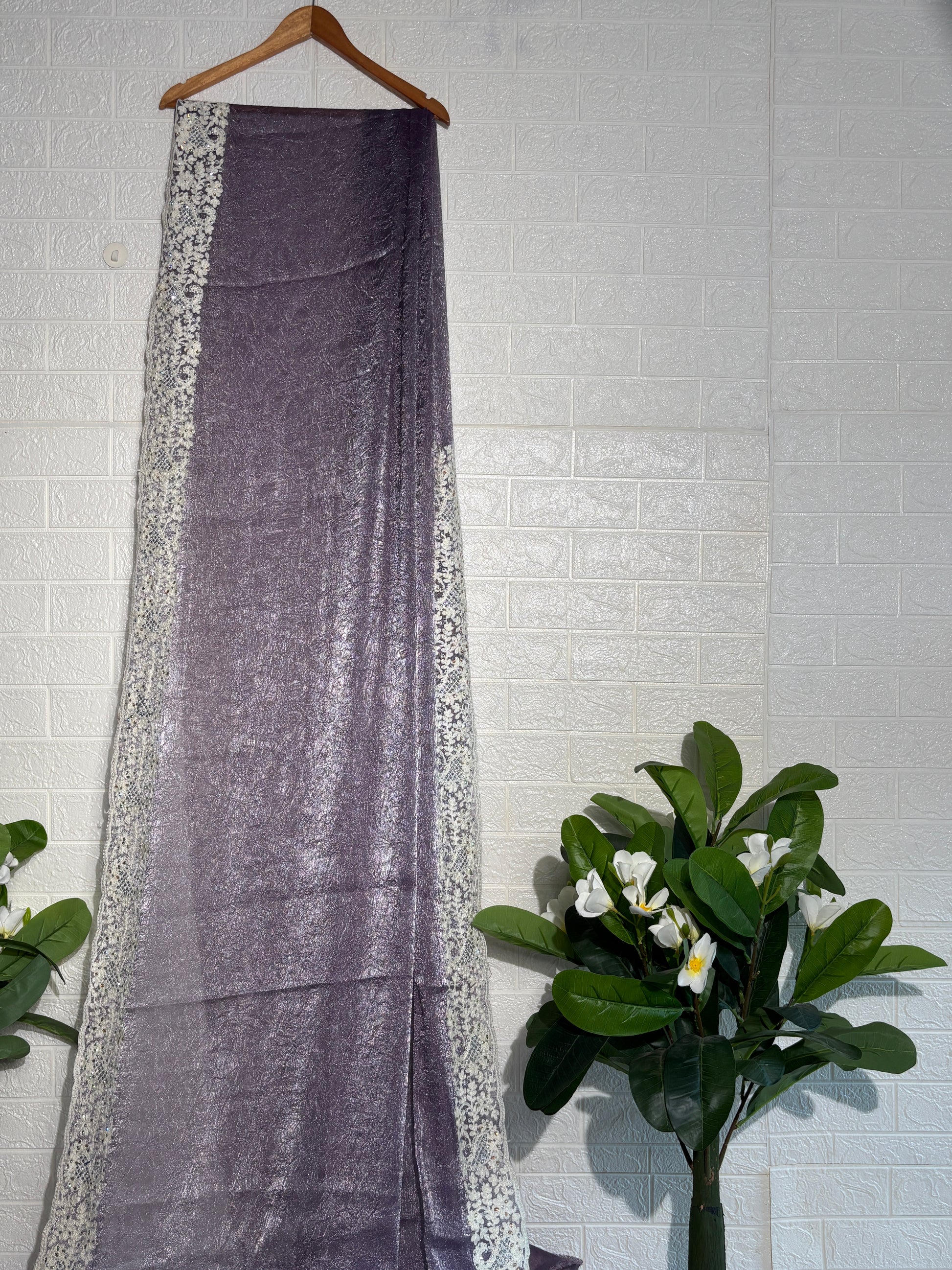 Shimmering Mauve Tissue Saree with Intricate Ivory Floral Border