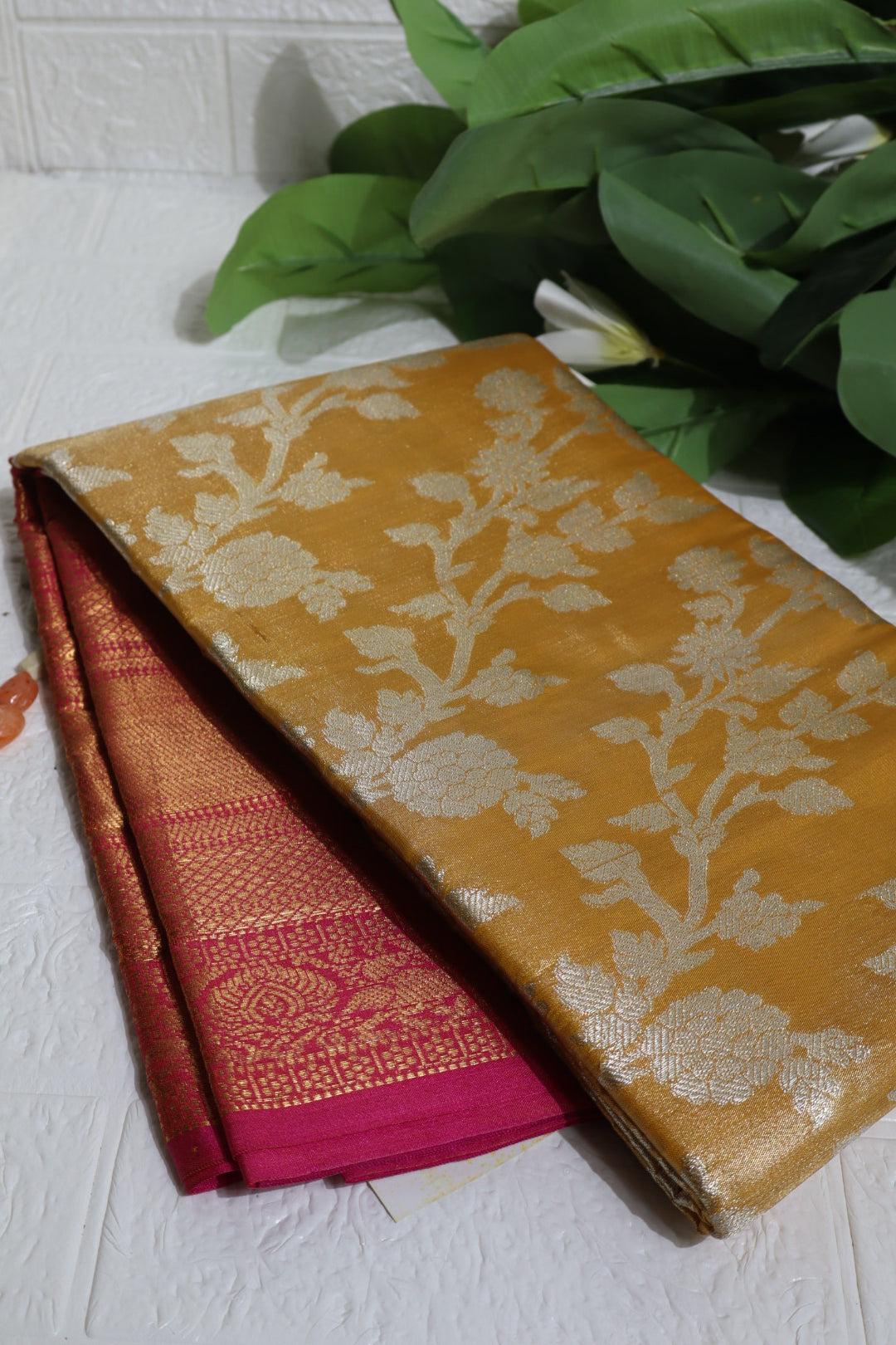 Mustard and Pink Banarasi Silk Saree with Silver Zari Floral Motifs