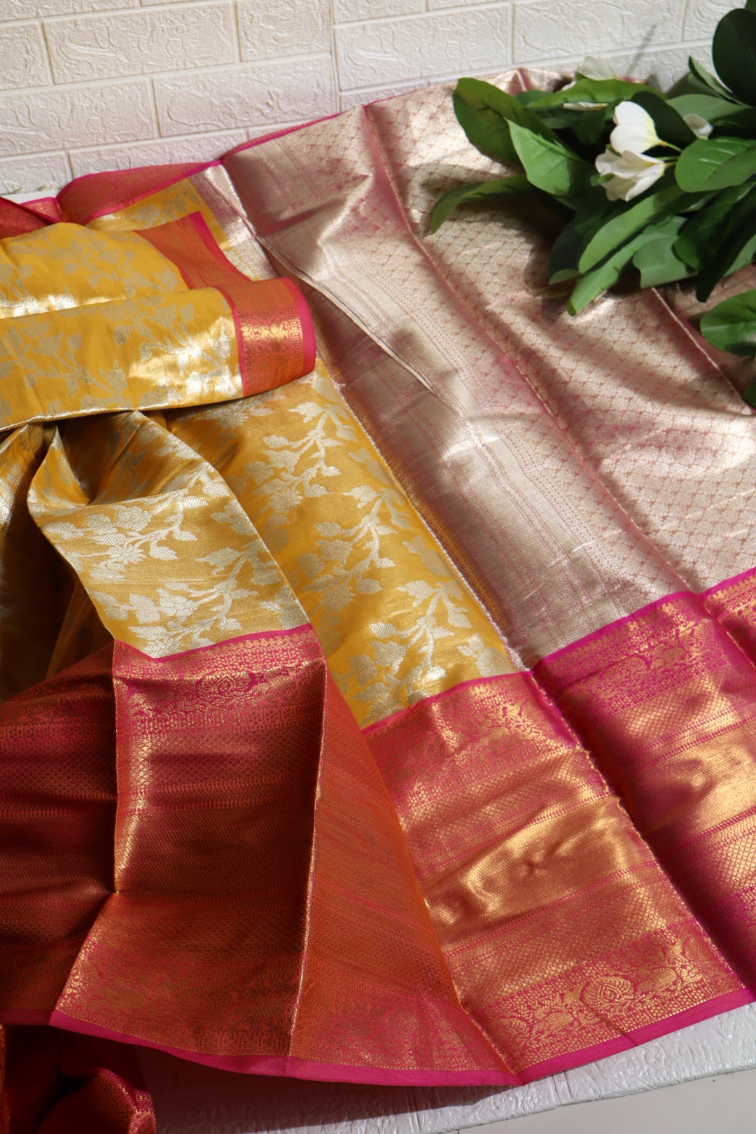 Mustard and Pink Banarasi Silk Saree with Silver Zari Floral Motifs
