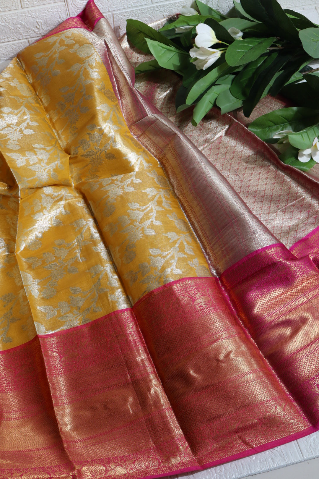 Mustard and Pink Banarasi Silk Saree with Silver Zari Floral Motifs