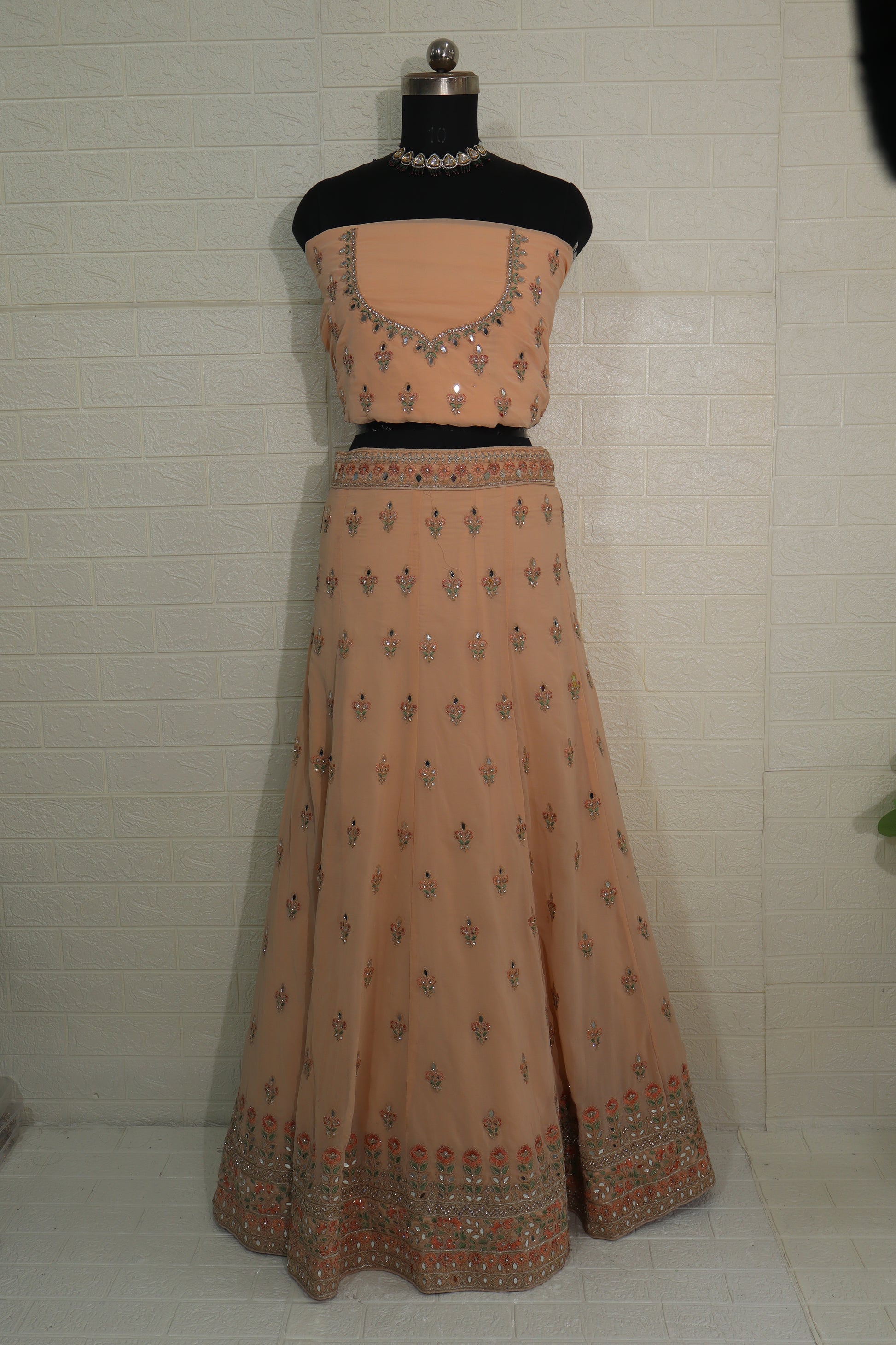 Peach Net Embroidered Lehenga Choli with Floral Detailing