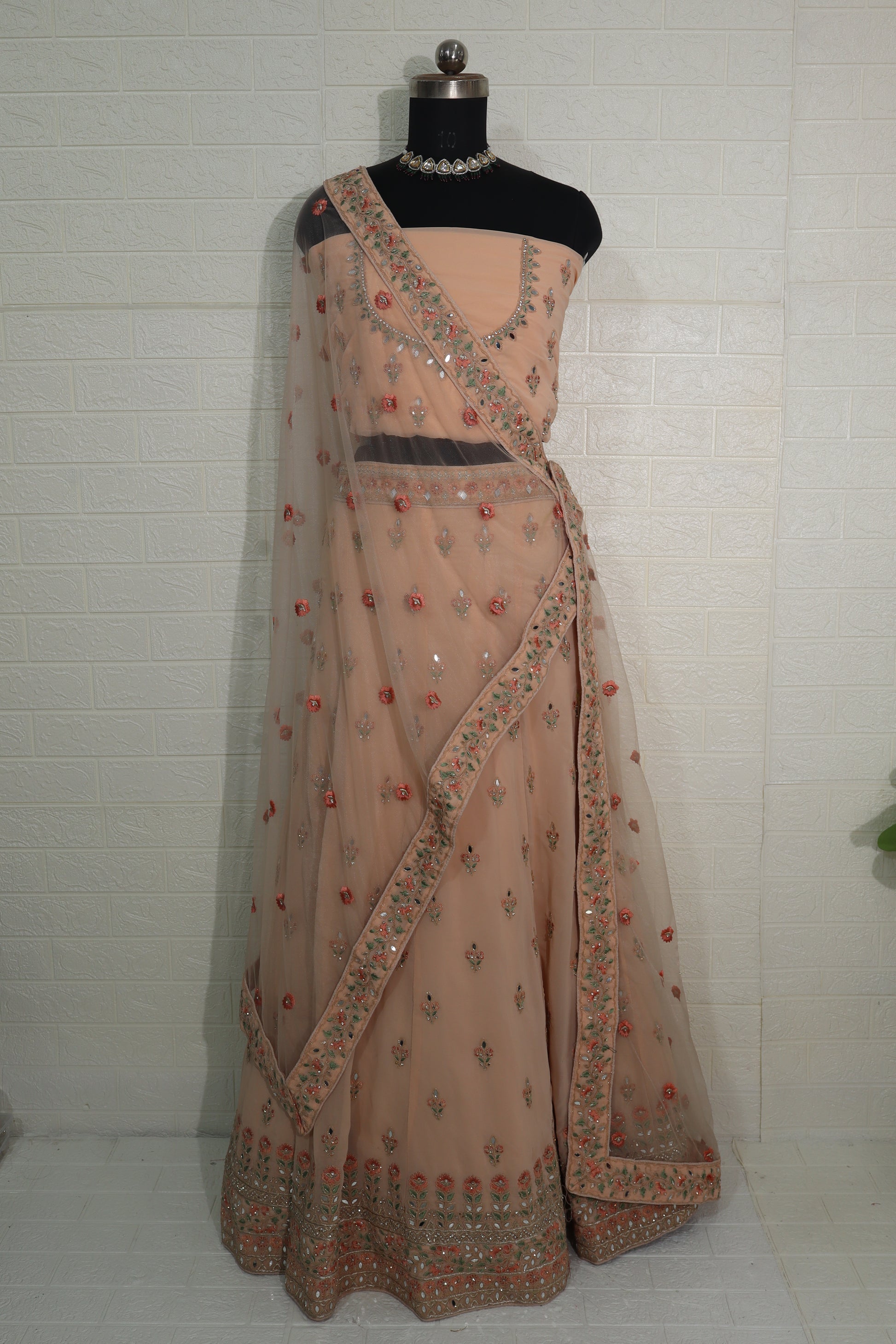 Peach Net Embroidered Lehenga Choli with Floral Detailing