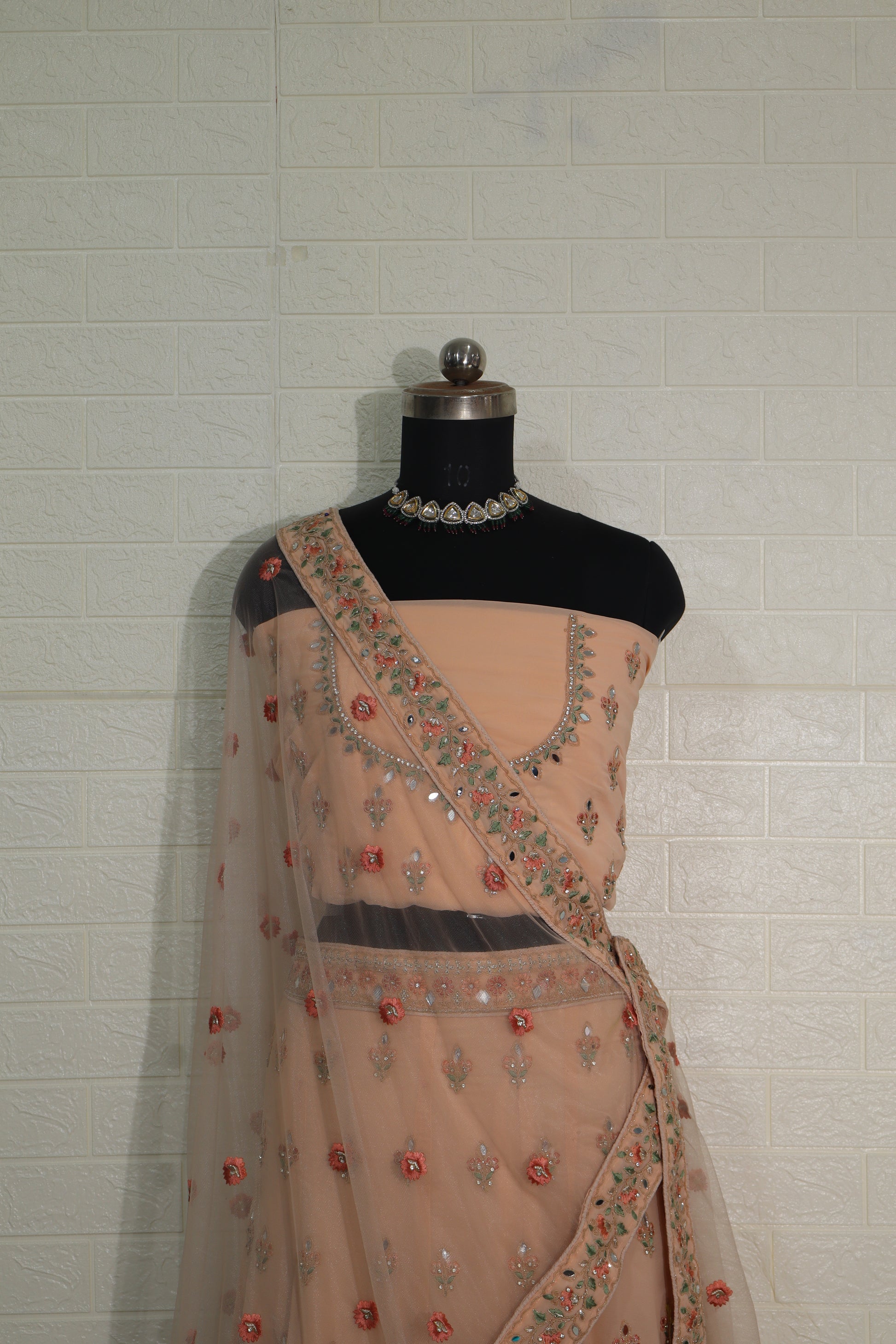 Peach Net Embroidered Lehenga Choli with Floral Detailing